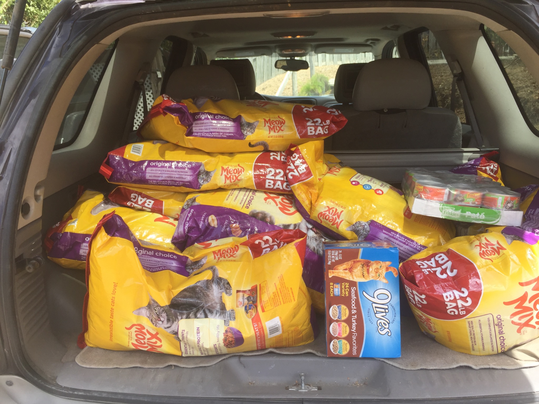 Vehicle filled with bags and cases of cat food for community-cat caregivers on St. Croix